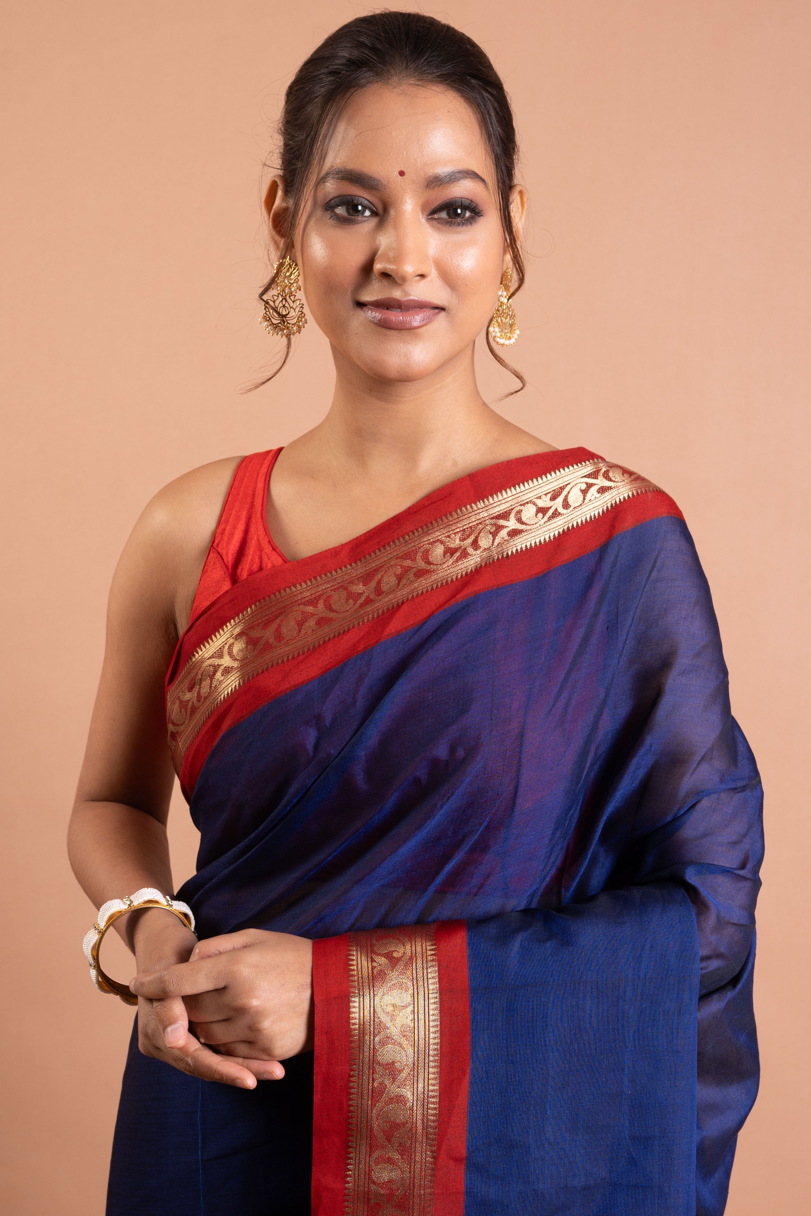 Neelanjali Navy–Red Zari Border Saree