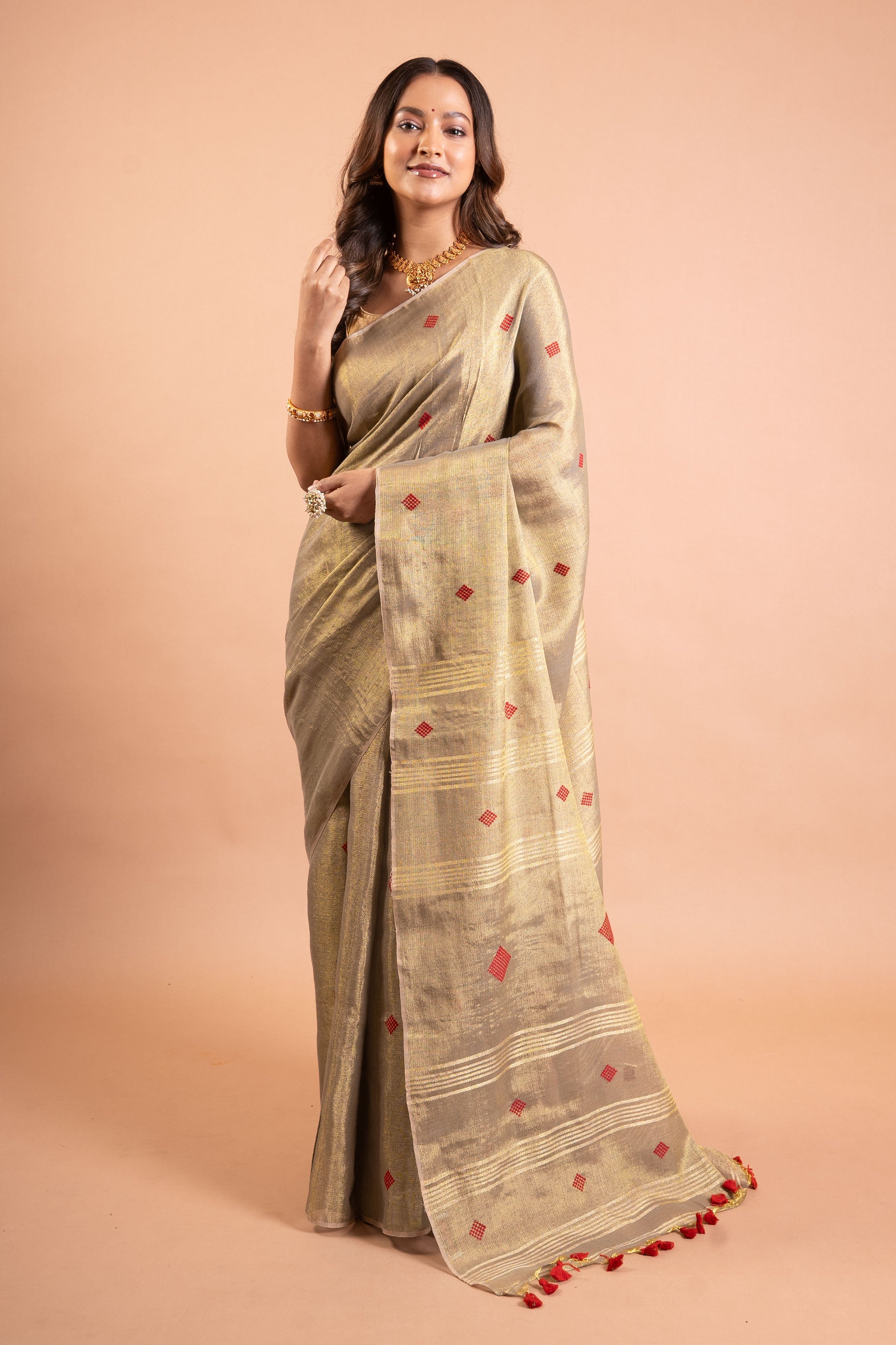 Champagne Gold Linen Tissue Saree with Red Butti & Tassels