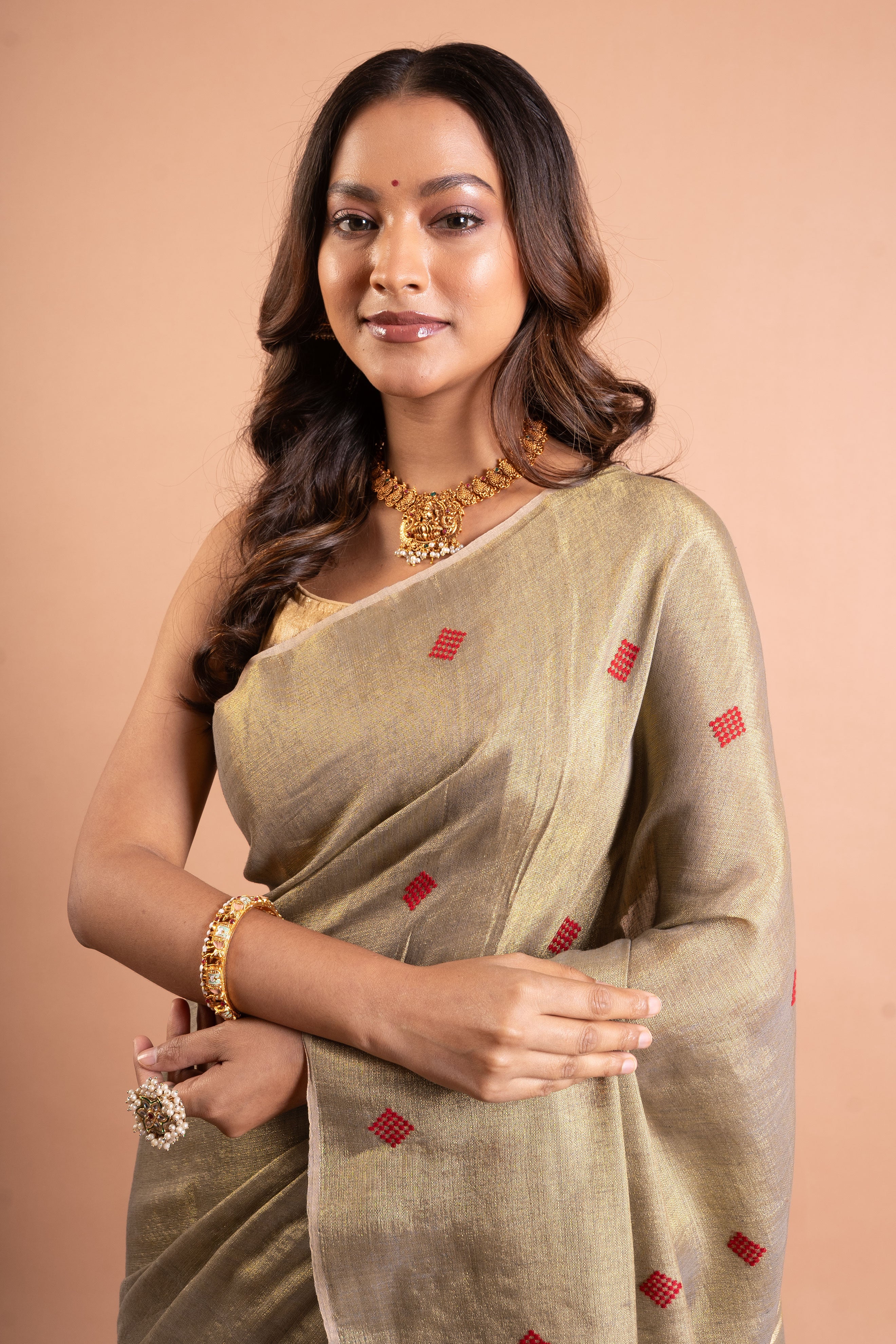 Champagne Gold Linen Tissue Saree with Red Butti & Tassels